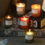 شمع معطّر في كأس زجاجي