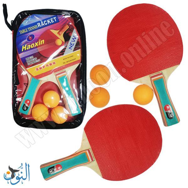 مضارب طاولة في حقيبة مع ثلاث كرات